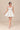 Vestido Renata corset con falda de vuelo y lazo frontal.
